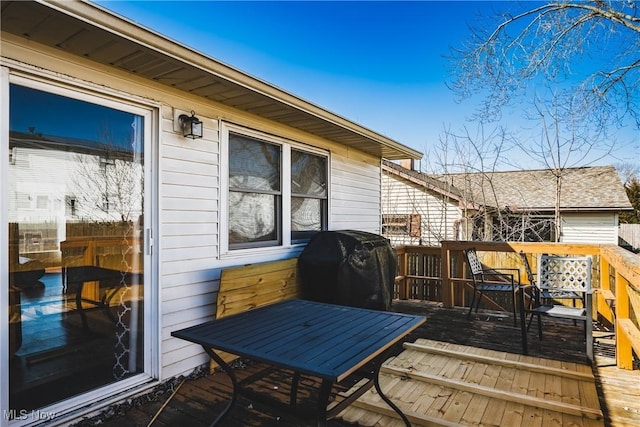 wooden terrace featuring area for grilling