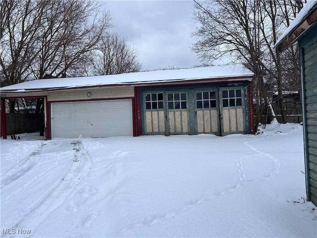 view of snow covered garage