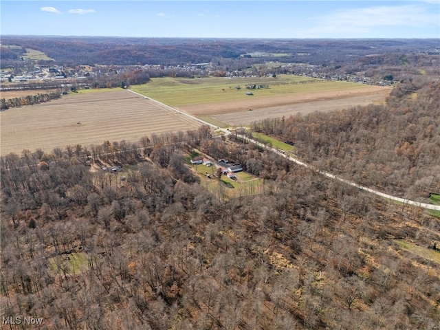 birds eye view of property with a rural view