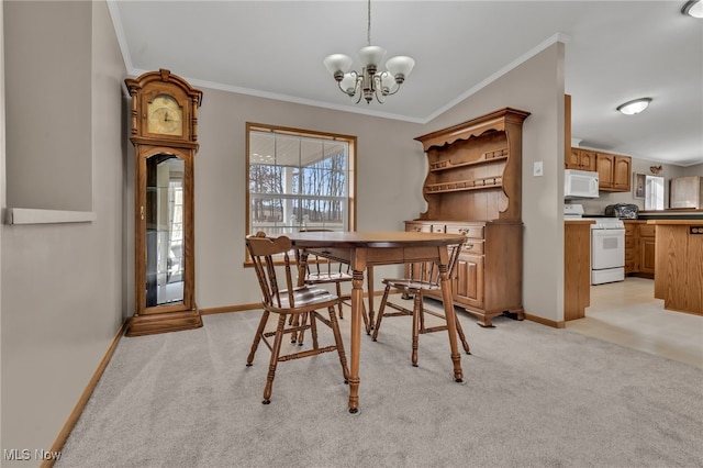 dining room featuring ornamental molding, a chandelier, and light colored carpet