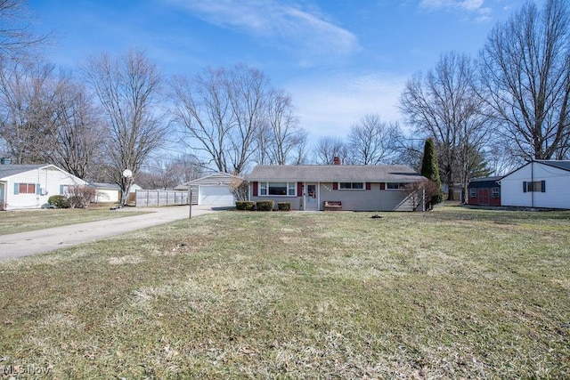 10684 Barcus Ave NE, Alliance, OH 44601 - ranch-style home featuring driveway, a chimney, an attached garage, fence, and a front lawn