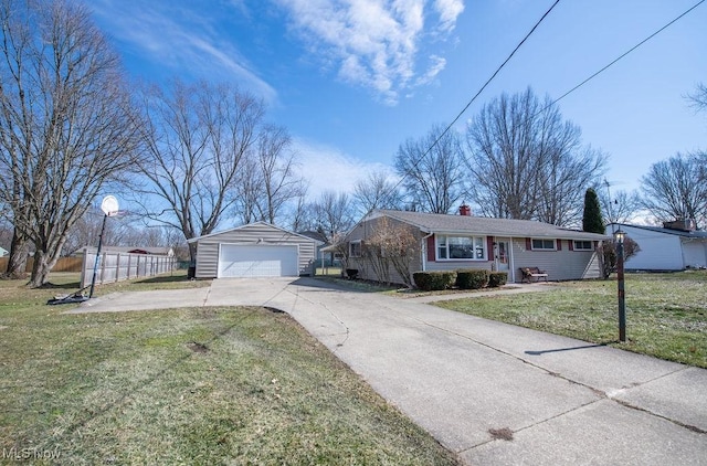 10684 Barcus Ave NE, Alliance, OH 44601 - single story home featuring an outbuilding, a detached garage, fence, a front lawn, and a chimney