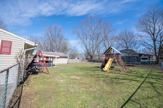 10684 Barcus Ave NE, Alliance, OH 44601 - view of yard with a trampoline, fence, and a playground
