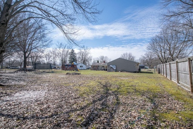 10684 Barcus Ave NE, Alliance, OH 44601 - view of yard featuring a playground and fence