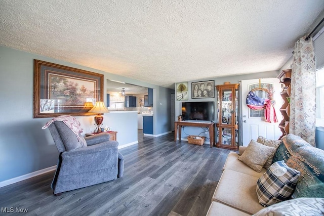 10684 Barcus Ave NE, Alliance, OH 44601 - living area featuring a textured ceiling, dark wood-type flooring, and baseboards