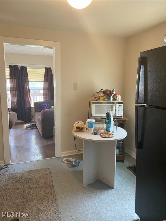 dining space featuring baseboards