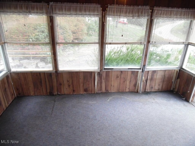 unfurnished sunroom featuring a wealth of natural light