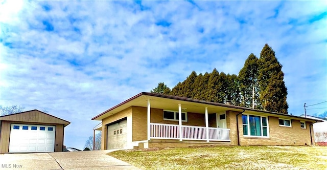 ranch-style house featuring brick siding, a porch, concrete driveway, and an attached garage