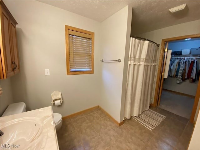 5 Grandview Dr, Mineral Wells, WV 26150 - bathroom with a shower with curtain, vanity, toilet, and baseboards