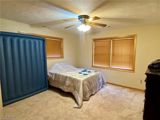 5 Grandview Dr, Mineral Wells, WV 26150 - carpeted bedroom with ceiling fan, a textured ceiling, and baseboards