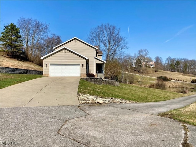 5 Grandview Dr, Mineral Wells, WV 26150 - view of front of property featuring a garage, concrete driveway, and a front yard