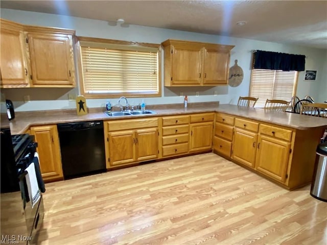 5 Grandview Dr, Mineral Wells, WV 26150 - kitchen with a peninsula, light wood-type flooring, black dishwasher, and a sink