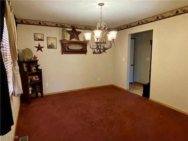 5 Grandview Dr, Mineral Wells, WV 26150 - carpeted spare room with visible vents, baseboards, and a notable chandelier