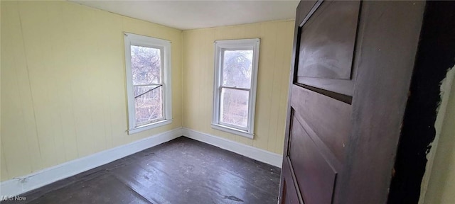 empty room featuring baseboards