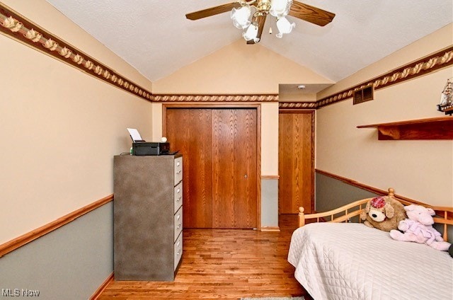 10400 Stoneacre St NW, Canal Fulton, OH 44614 - bedroom with lofted ceiling, wood finished floors, ceiling fan, and baseboards