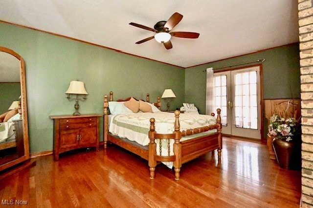 10400 Stoneacre St NW, Canal Fulton, OH 44614 - bedroom featuring wood finished floors, arched walkways, and ceiling fan