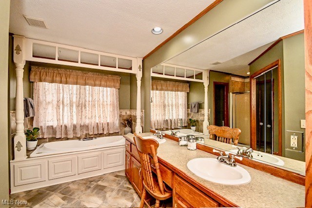 10400 Stoneacre St NW, Canal Fulton, OH 44614 - bathroom with a garden tub and double vanity