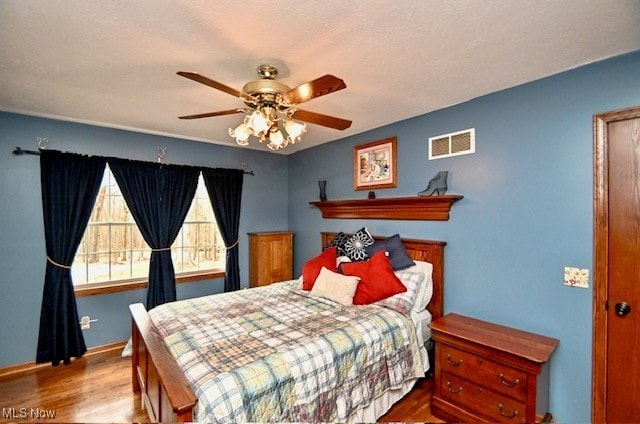 10400 Stoneacre St NW, Canal Fulton, OH 44614 - bedroom with wood finished floors, baseboards, and a ceiling fan