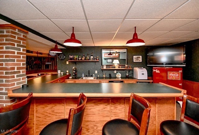 10400 Stoneacre St NW, Canal Fulton, OH 44614 - indoor wet bar featuring a paneled ceiling and wainscoting