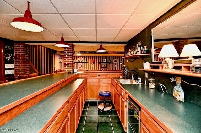 10400 Stoneacre St NW, Canal Fulton, OH 44614 - indoor wet bar featuring a drop ceiling, wine cooler, and dark tile patterned flooring