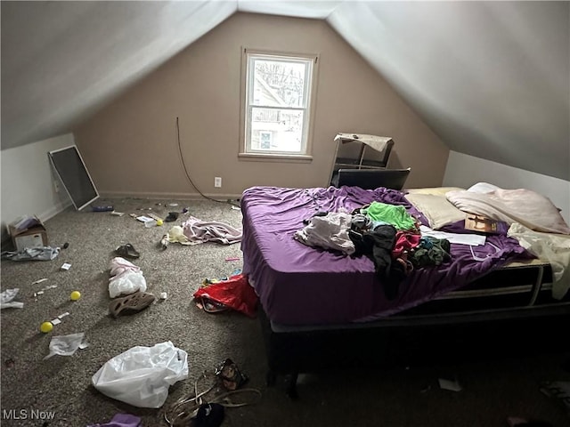 bedroom with vaulted ceiling and baseboards