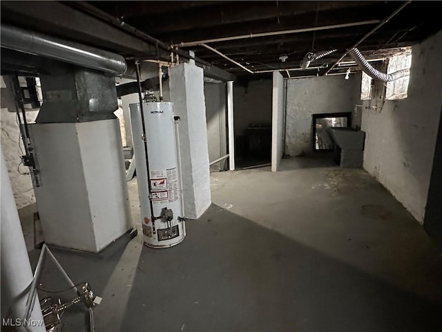 basement featuring heating unit and water heater