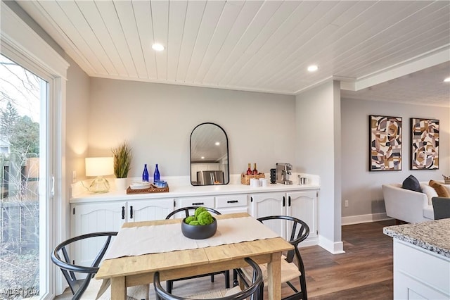 dining area featuring baseboards, dark wood finished floors, wood ceiling, and recessed lighting