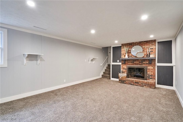 unfurnished living room featuring carpet, a fireplace, recessed lighting, stairway, and baseboards