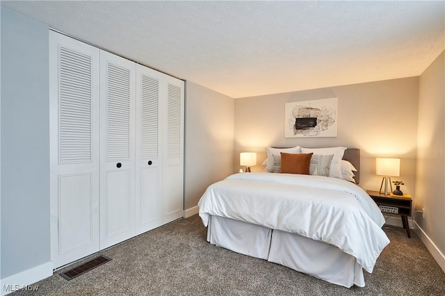 bedroom with carpet flooring, visible vents, and baseboards