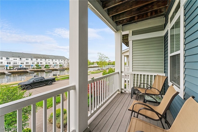 balcony with a porch and a water view