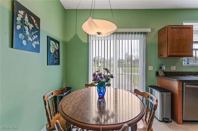 dining space featuring light tile patterned flooring