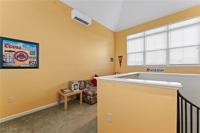 carpeted bedroom with a wall unit AC, vaulted ceiling, and baseboards