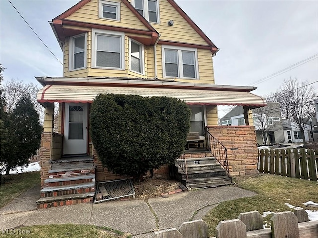 view of front of house with fence