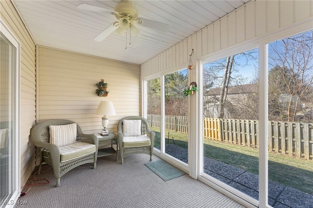 sunroom with a ceiling fan