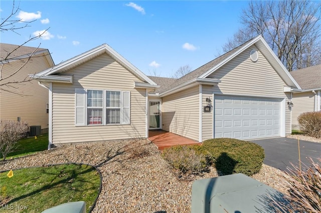 view of front of home featuring aphalt driveway and an attached garage