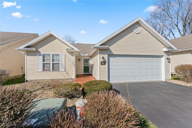 ranch-style house with an attached garage and driveway