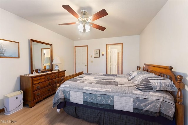 bedroom featuring light wood-style floors and ceiling fan