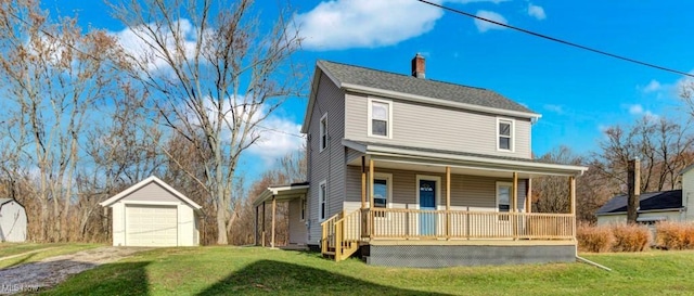 view of front of property featuring a garage, a chimney, an outbuilding, covered porch, and a front yard