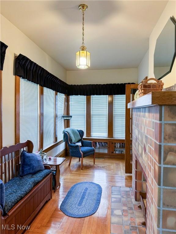 4109 Grand Central Ave, Vienna, WV 26105 - interior space with light wood-type flooring and a brick fireplace