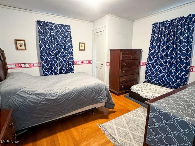 bedroom with wood finished floors