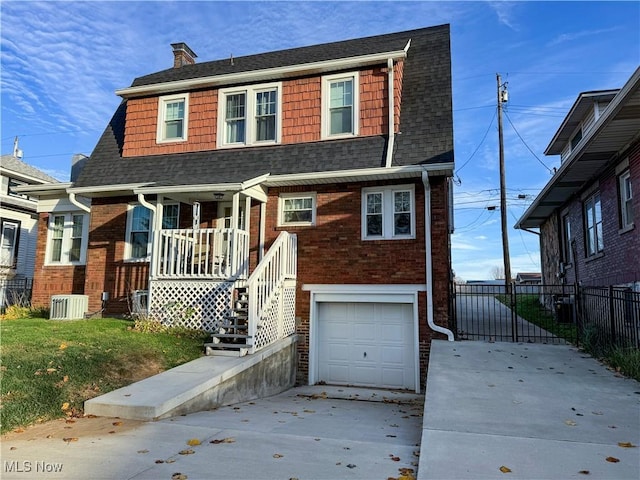 view of front of house featuring covered porch, central AC, fence, a garage, and driveway