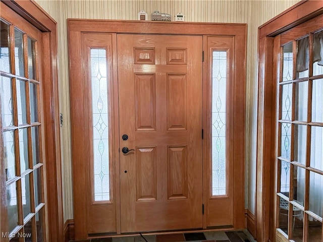 entryway with wallpapered walls