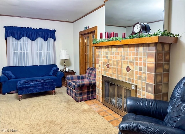 living area featuring a fireplace, ornamental molding, and tile patterned floors