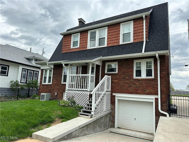 4109 Grand Central Ave, Vienna, WV 26105 - dutch colonial featuring an attached garage, a front lawn, fence, and roof with shingles