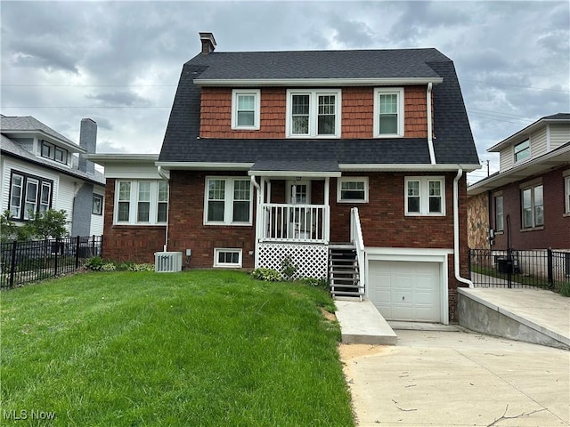 4109 Grand Central Ave, Vienna, WV 26105 - dutch colonial with fence, driveway, a shingled roof, and a front lawn