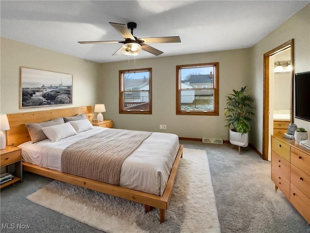 bedroom featuring carpet floors, visible vents, ceiling fan, and baseboards