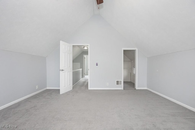 11915 Franklin Blvd, Lakewood, OH 44107 - additional living space featuring lofted ceiling, baseboards, visible vents, and carpet flooring