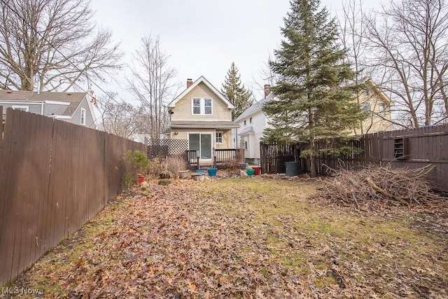 11915 Franklin Blvd, Lakewood, OH 44107 - rear view of house featuring a fenced backyard, a chimney, and a deck