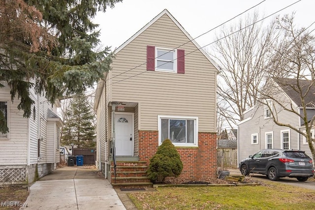 11915 Franklin Blvd, Lakewood, OH 44107 - view of front of property with entry steps, driveway, and brick siding