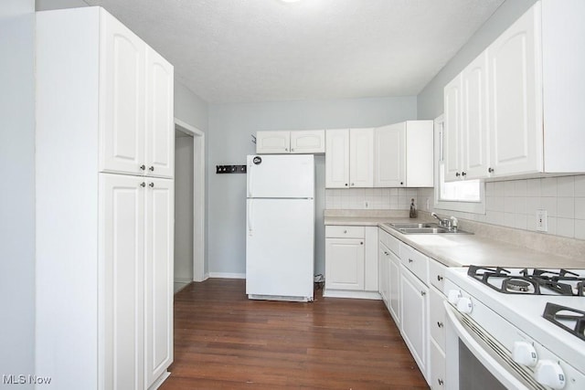 11915 Franklin Blvd, Lakewood, OH 44107 - kitchen with white appliances, white cabinetry, dark wood-style flooring, and a sink